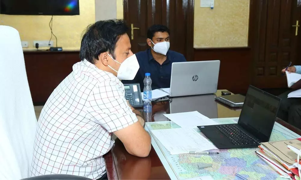 Collector Pravin Kumar, JC KS Viswanathan conducting a video-conference with officials on TIDCO houses in Ongole on Wednesday