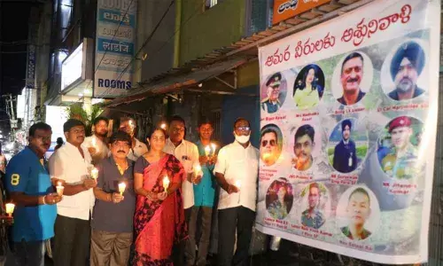 BJP leaders led by Gundala Gopinath paying homage to Indias first Chief of Defence Staff General Bipin Rawat and other defence staff, who were killed in a chopper crash in Tamil Nadu, at GS Mada Street in Tirupati on Thursday.