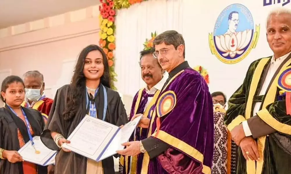 TN governor R N Ravi, Chancellor of Bharathidasan University, presenting medals and degree certificates to graduates during the 37th graduation day in Tiruchy