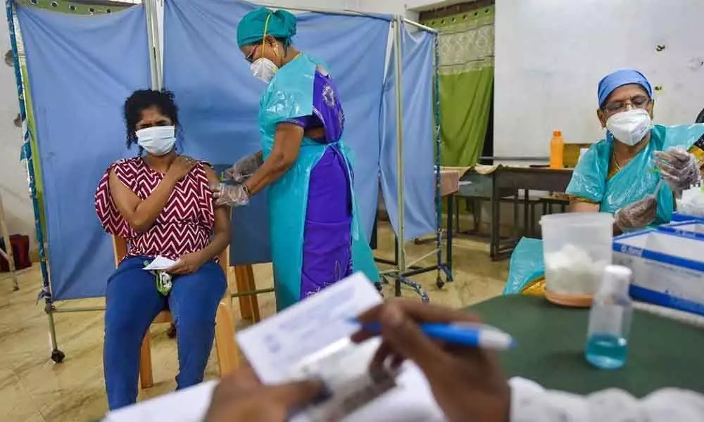 A health worker administers a dose of a Covid-19 vaccine in Chennai. (Pic Courtesy: PTI)