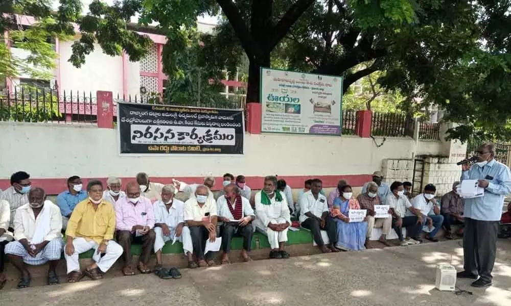 OPDR vice-president Chavali Sudhakar addressing the protestors at the Collectorate in Ongole on Friday