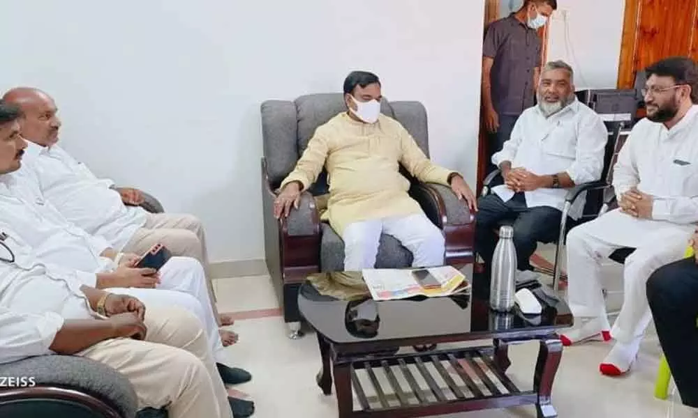 Minorities Welfare Minister Amjad Basha with Muslim JAC leaders Shaik Muneer Ahmed and others in Vijayawada on Friday