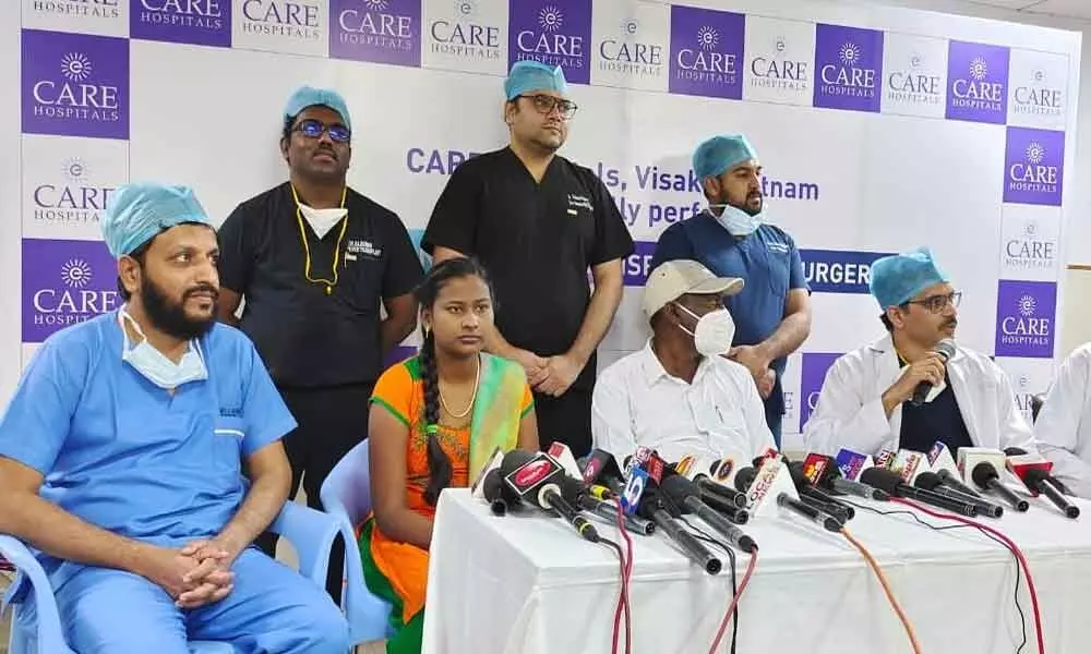 A team of doctors at Care Hospital with liver donor and recipient in Visakhapatnam on Friday