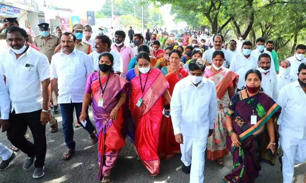 Minister Jagadish Reddy along with local body representatives heading towards polling centre in Suryapet on Friday