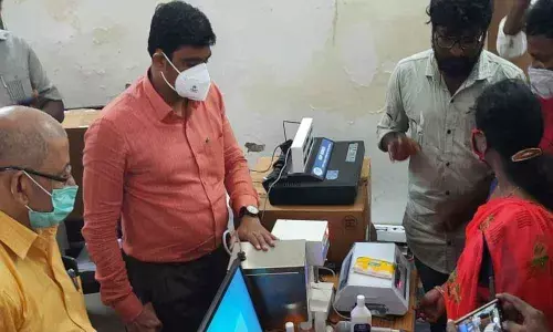 Collector J Nivas interacting with the staff at the training session conducted for women dairy farmers at Mylavaram  in Krishna district  on Friday
