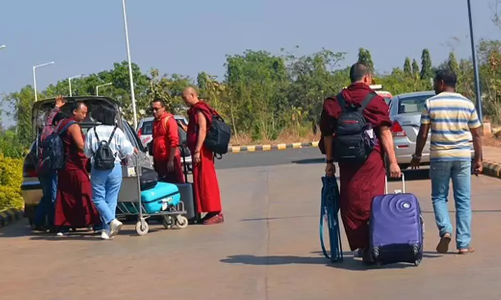 Air passengers are catching a taxi at Hubballi Airport.