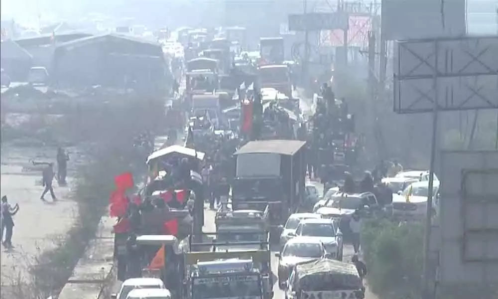 Slow traffic movement seen at KMP flyover near Singhu border (Photo/ ANI)