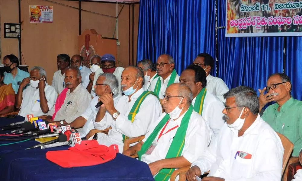 Former minister and AP Convener of AP Farmers’ Associations Co-ordination Committee Vadde Sobhanadreewara Rao addressing the leaders of various farmers association at a meeting organised to celebrate the victory of farmers in their fight against three farm laws, in Vijayawada on Saturday