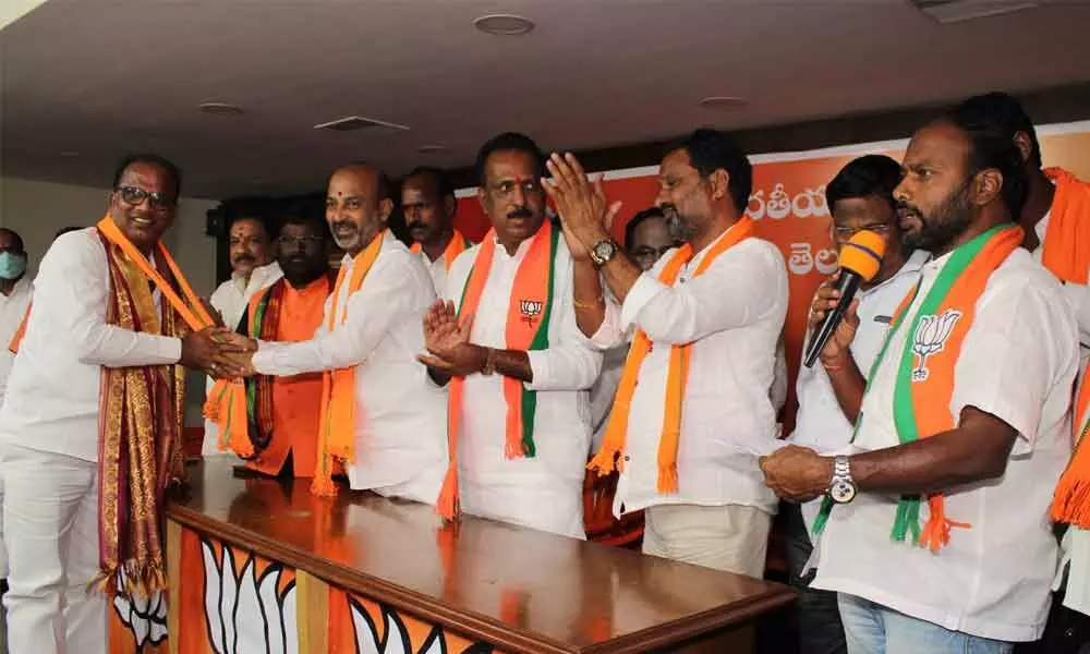 Rangareddy district Amangal mandal Mangalpally Sarpanch and others joined in BJP in the presence of Bandi Sanjay Kumar, MP and BJP State president, in Hyderabad on Saturday