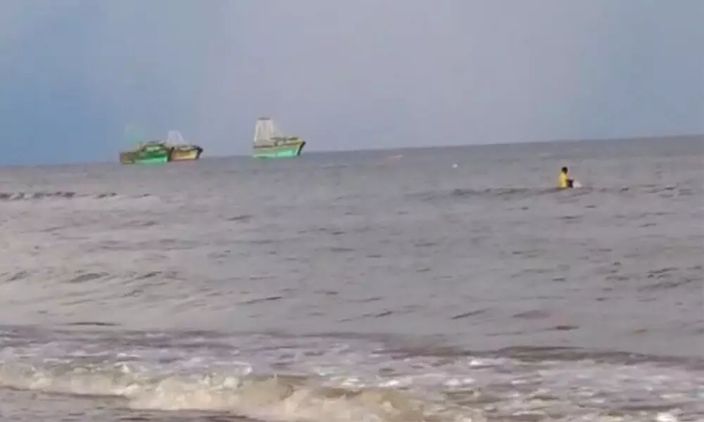 A screen grab from a video of the heavy trawlers from Tamil Nadu fishing near sea shore in Prakasam district