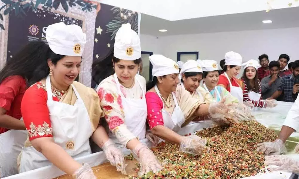 Cake mixing and grape stomping ceremony held at an institute in Visakhapatnam
