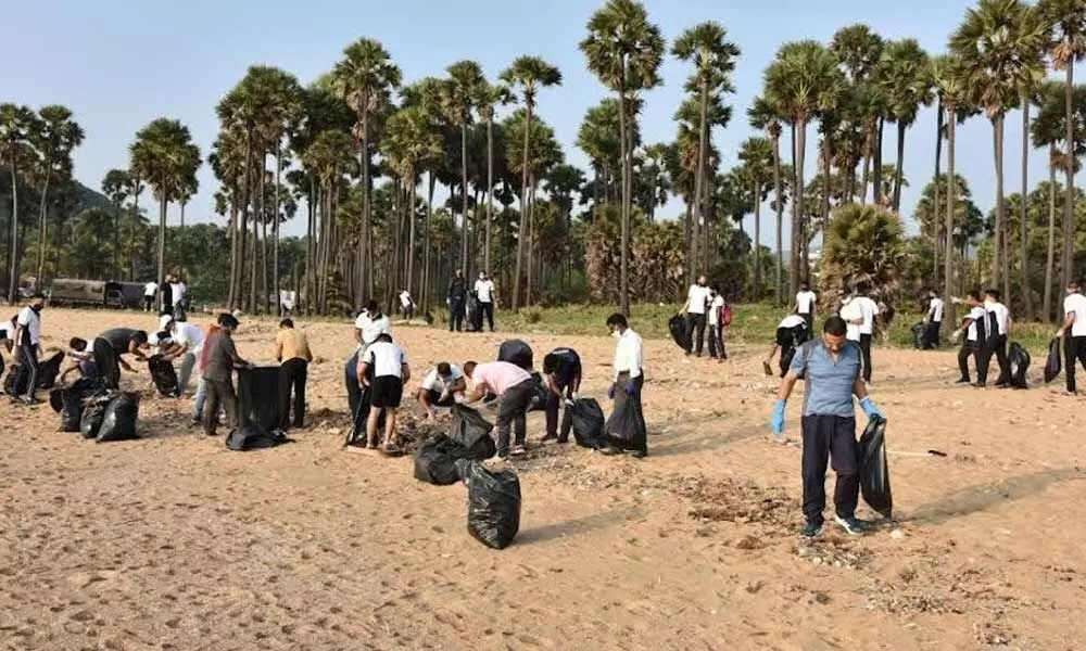 Naval personnel taking part in a beach cleanup drive organised by the Eastern Naval Command in Visakhapatnam on Sunday
