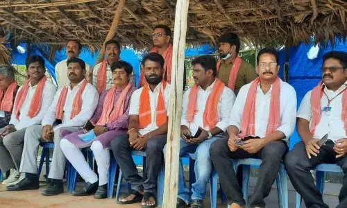 Jana Sena Party activists taking part in a one-day fast at Kurmannapalem in Visakhapatnam on Sunday