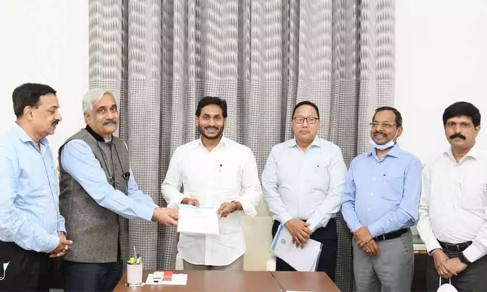 Chief Secretary Sameer Sarma hands over the Pay Revision Commission report to CM Jagan Mohan Reddy at his camp office in Tadepalli on Monday.  Special CS (Revenue) Rajat Bhargava and other officials are also seen
