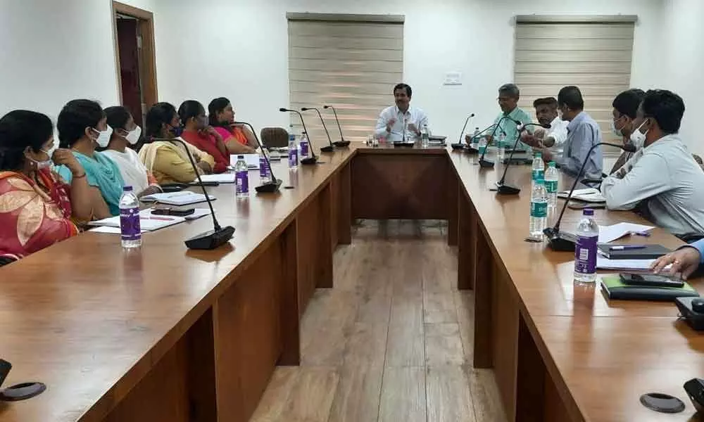 Telangana State Cooperative Apex Bank MD Dr Nethi Muralidhar interacting with officials on BR Act in Karimnagar on Monday