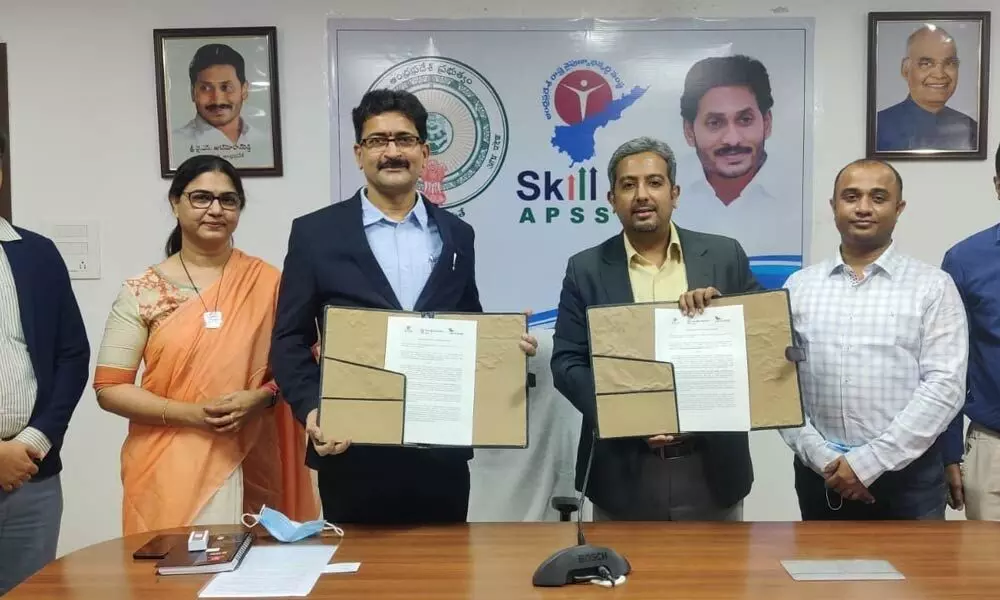 APSSDC  MD N Bangara Raju and the representatives of Cambridge University English exchanging MoU for providing training in English in skill colleges across the State on Tuesday