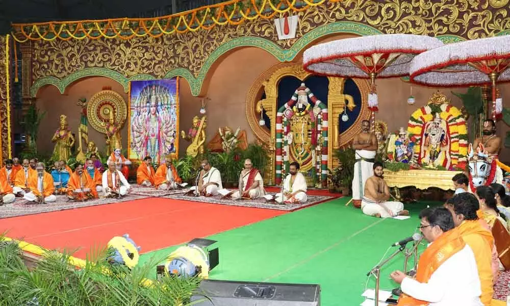 Vedic pundits and devotees rendering Slokas from Bhagavad Gita at Naada Neerajanam platform at Tirumala on Tuesday