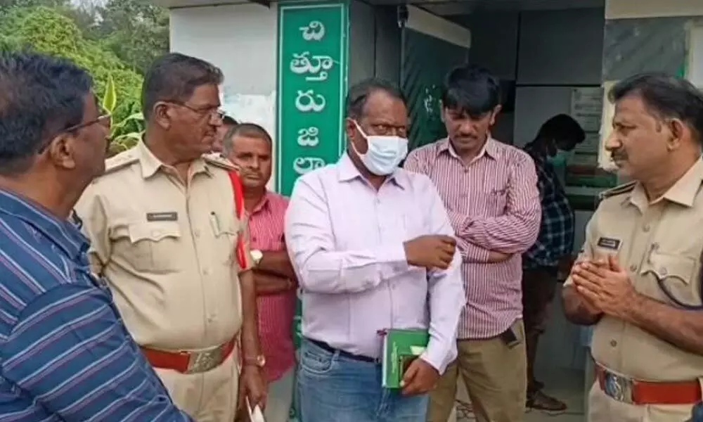 Chittoor DSP Sudhakar Reddy and other police personnel collecting details from bank officials at ATM centre at T Rangampeta cross road in Puthalapattu mandal on Tuesday