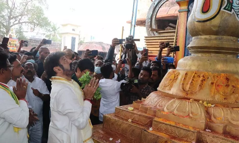 Film actor Nandamuri Balakrishna offering prayers at Sri Lakshmi Narasimha Swamy temple in Mangalagiri on Wednesday