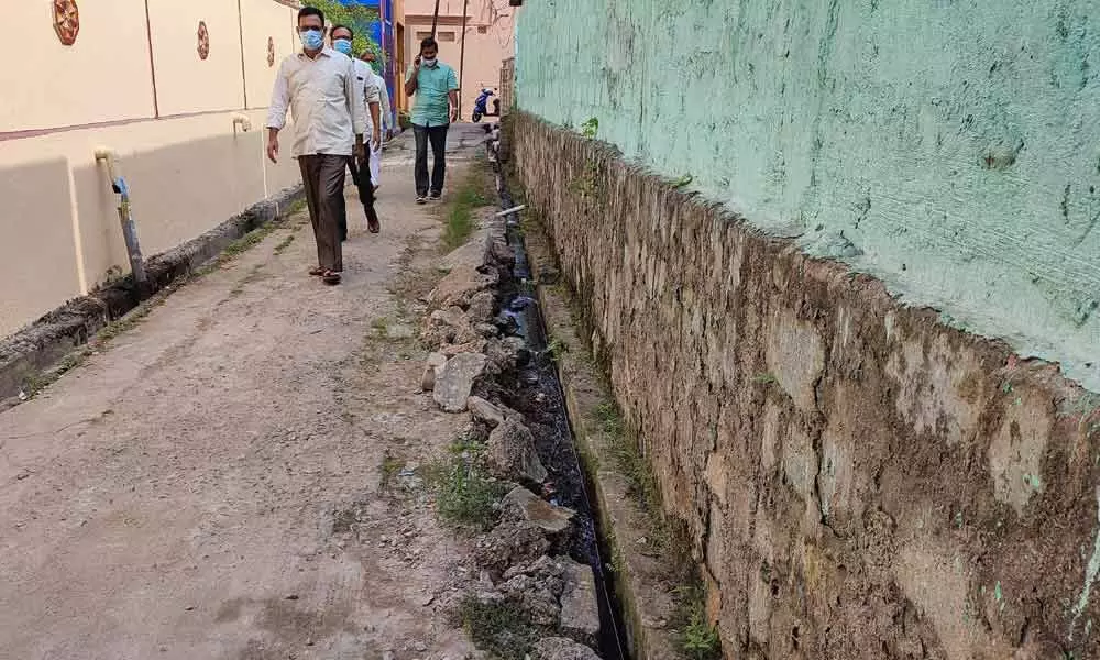 A dilapidated drain and road in the locality