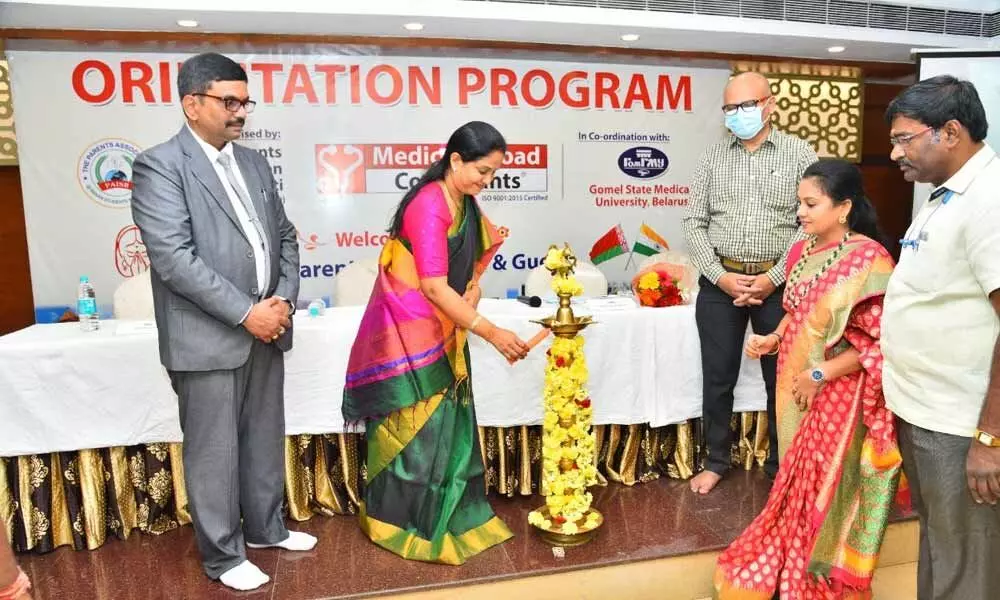 Mayor Dr R Sirisha lighting the lamp at MBBS students orientation programme in Tirupati on Wednesday. Dr N Nageswara Rao, Veera Kiran and others are also seen.