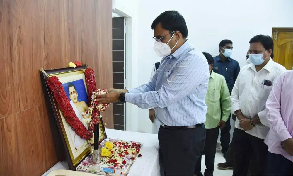 District Collector K V N Chakradhar Babu paying floral tributes to the portrait of Amarajeevi in Nellore on Wednesday