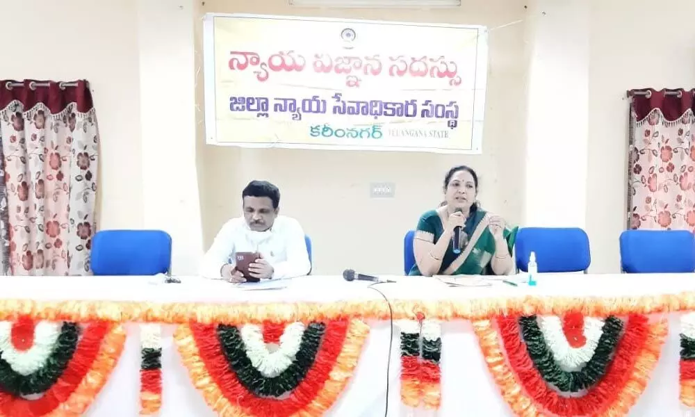 District Court Chief Justice Priyadarshini addressing the postal employees during legal seminar held in Karimnagar on Wednesday