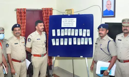 Vijayawada East DCP Harshavardhan Raju with the recovered cash in Vijayawada on Wednesday