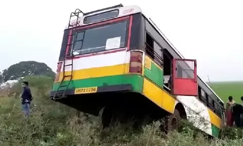 The RTC bus which fell into roadside irrigation canal at Kakamanu in Guntur district on Wednesday