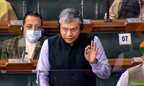 Union Minister Ashwini Vaishnaw speaks in the Lok Sabha during the Winter Session of Parliament, in New Delhi on Wednesday