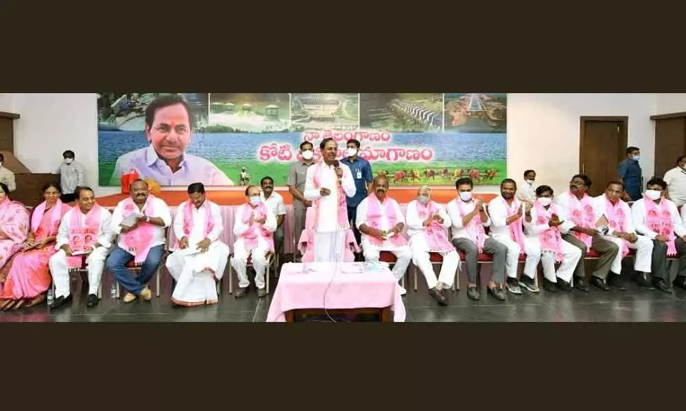 Chief Minister K Chandrashekar Rao addressing the extended steering committee meeting of TRS in Hyderabad on Friday