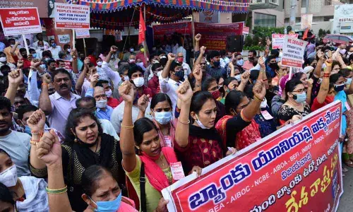 Bank employees and officers stage protest against the government’s move to privatise  public sector banks  on the second day of two-day strike in Vijayawada Friday