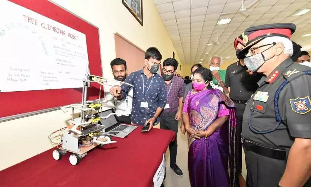 Governor Dr Tamilisai Soundararajan observing a robotic model displayed at Robothon-2021 at the Military College of Electronics and Mechanical Engineering in Hyderabad on Saturday