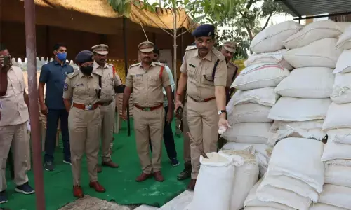 Suryapet District SP Rajendra Prasad examining the seized adulterated bran on Saturday