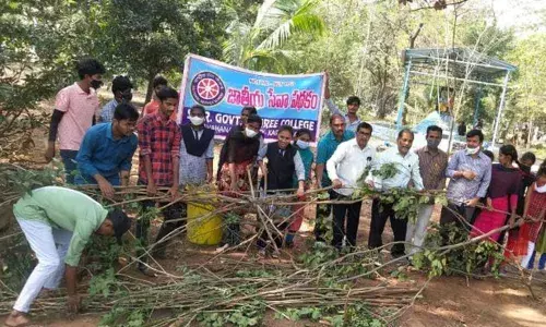 NSS students cleaning up the premises of SRR government degree college in Karimnagar on Saturday