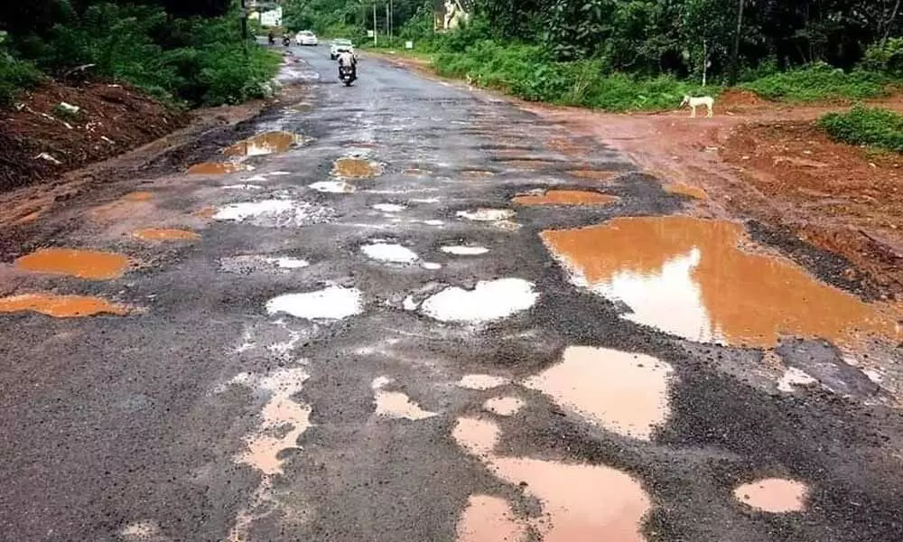 A pothole-filled road in Bengaluru