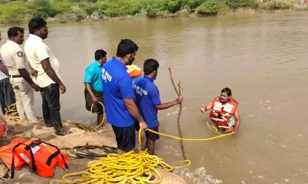 Divers engaged in search operation at Swarnamukhi river on Sunday