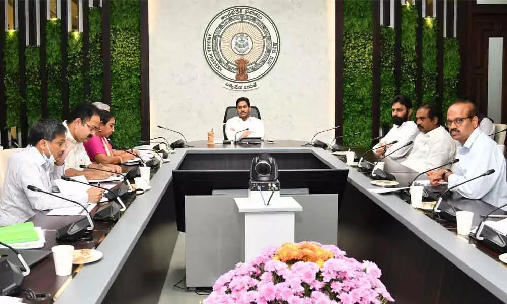 Chief Minister Y S Jagan Mohan Reddy holding a review meeting with the officials of Agriculture, Food and Civil Supplies departments at his camp office in Tadepalli on Monday