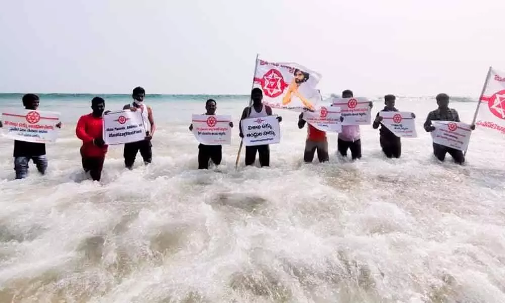 JSP corporator P Murthy Yadav and party members staging a novel protest against the privatisation of VSP at the shore in Visakhapatnam on Monday