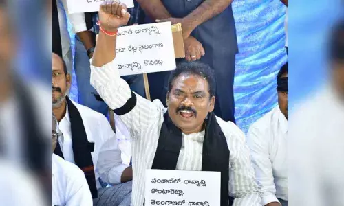 MLA Sunke Ravishankar staging dharna at Gangadhar Chowrasta in Jagtial district on Monday