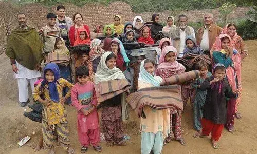 Blankets and clothes distributed in a slum by a Church NGO in Anantapur.