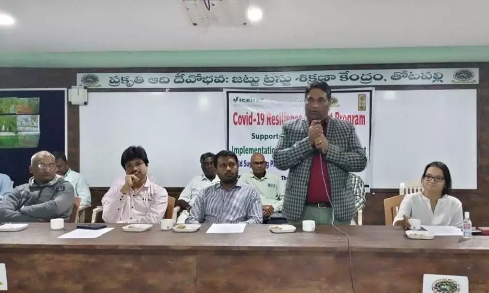 Digital Green Trust director Kunal Tiwari addressing the farmers in Vizianagaram on Tuesday