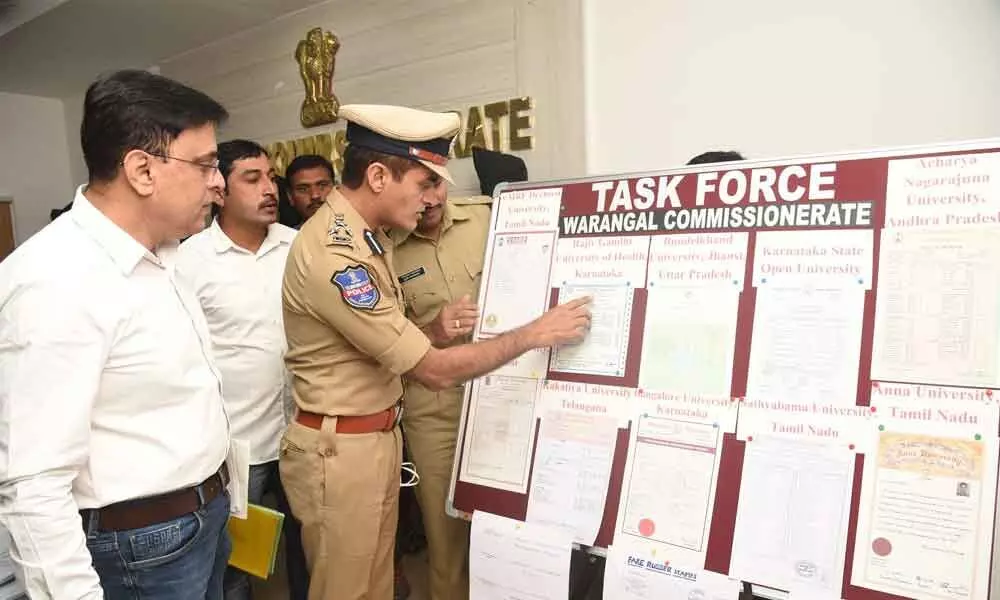 Commissioner of Police Tarun Joshi showing fake certificates to media at Warangal Police Commissionerate on Tuesday