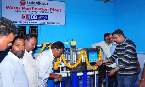 HDB Financial Services Ltd zonal manager Mohan Vamsi Palem inaugurating clean drinking water plant at Yerrabalem village under Krosuru in Guntur district on Tuesday