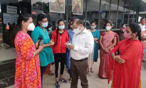Joint Collector GC Kishore interacting with the moviegoers and inspecting ticket prices at S-3 theatre in Nellimarla on Tuesday