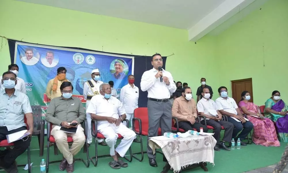 District Collector Vivek Yadav addressing a meeting in Mangalagiri on Wednesday. MLC Murugudu Hanumantha Rao and MLA Alla Rama Krishna Reddy are also seen