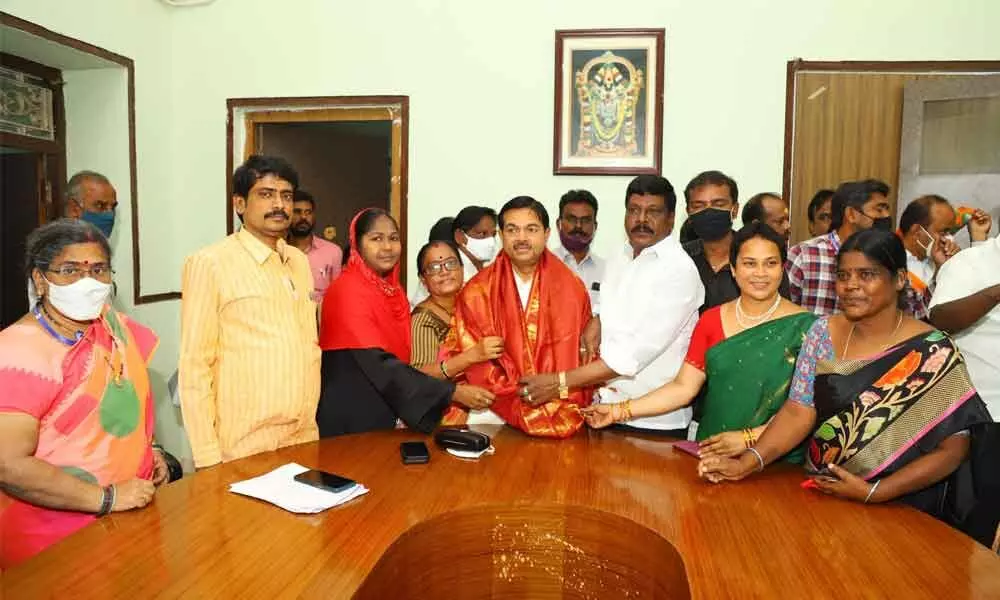 Tirupati Cooperative Town Bank employees felicitating Union Minister of State for Cooperation BL Verma during his visit to bank on Thursday