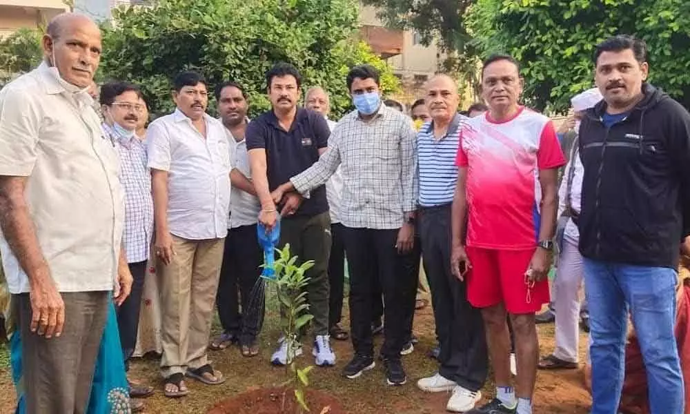 GVMC Commissioner G Lakshmisha and NREDCAP chairman KK Raju at a tree plantation programme held in Visakhapatnam on Thursday