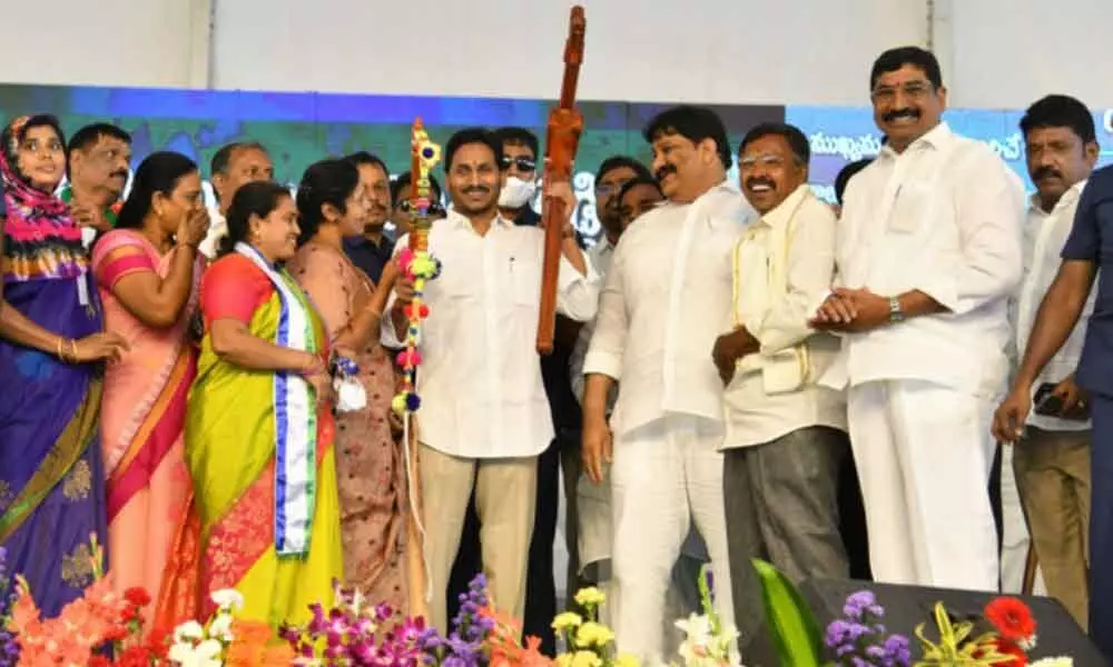 Local YSRCP leaders presenting a plough and a whip to Chief Minister Y S Jagan Mohan Reddy at a public meeting in Proddutur in Kadapa district on Thursday