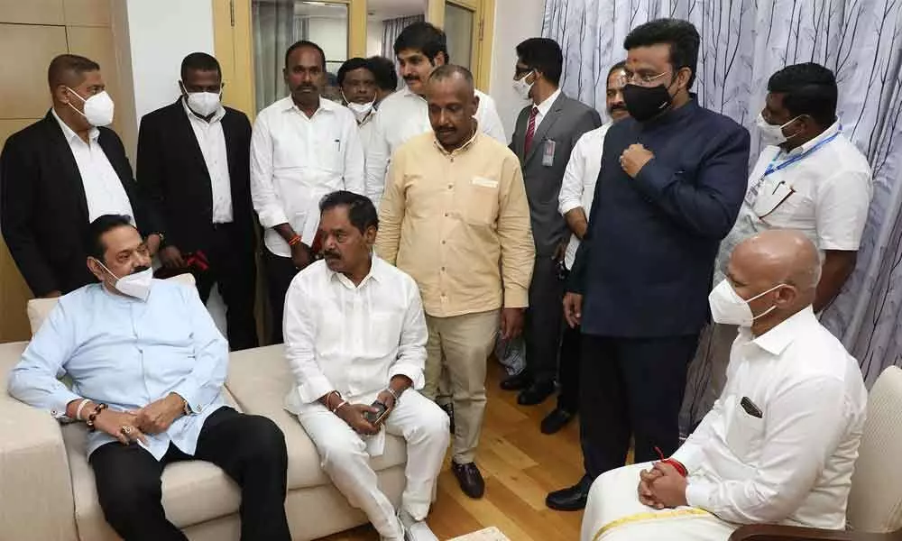 Deputy Chief Minister K Narayana Swamy and TTD additional EO A V Dharma Reddy with Sri Lanka Prime Minister Mahinda Rajapaksa in Tirumala on Thursday